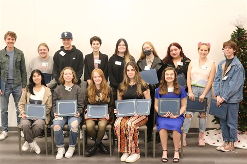 A group shot of the 24 high school students with their certificates of winning the High School Visual Art competition. 