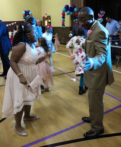 Dad and daughter dancing