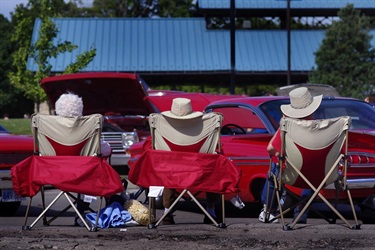 3 seated spectators