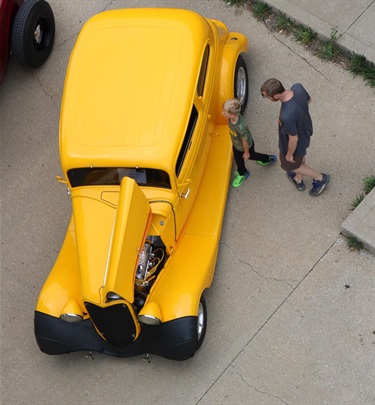 Checking out the cool yellow car