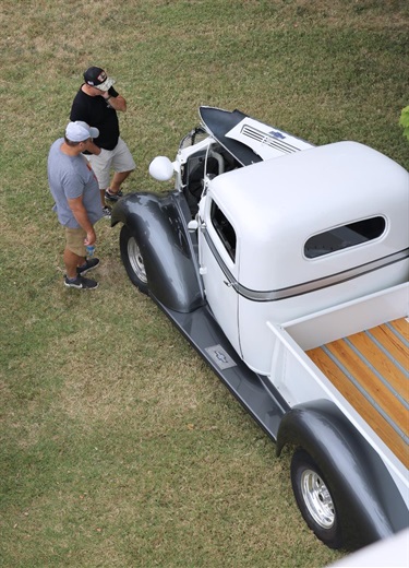 2 guys contemplating the classic truck