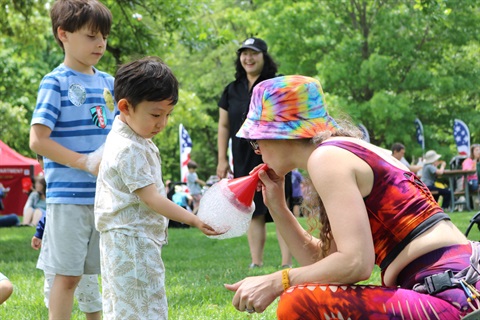 Child-playing-with-bubbles-at-Turkey-Creek-Festival.jpg