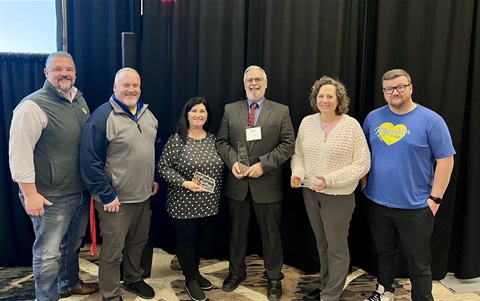 City staff hold three crystal awards at a Parks and Recreation conference.