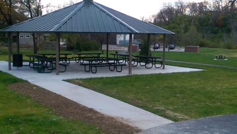 Shelter with 7 picnic tables and large grill at Brown Park
